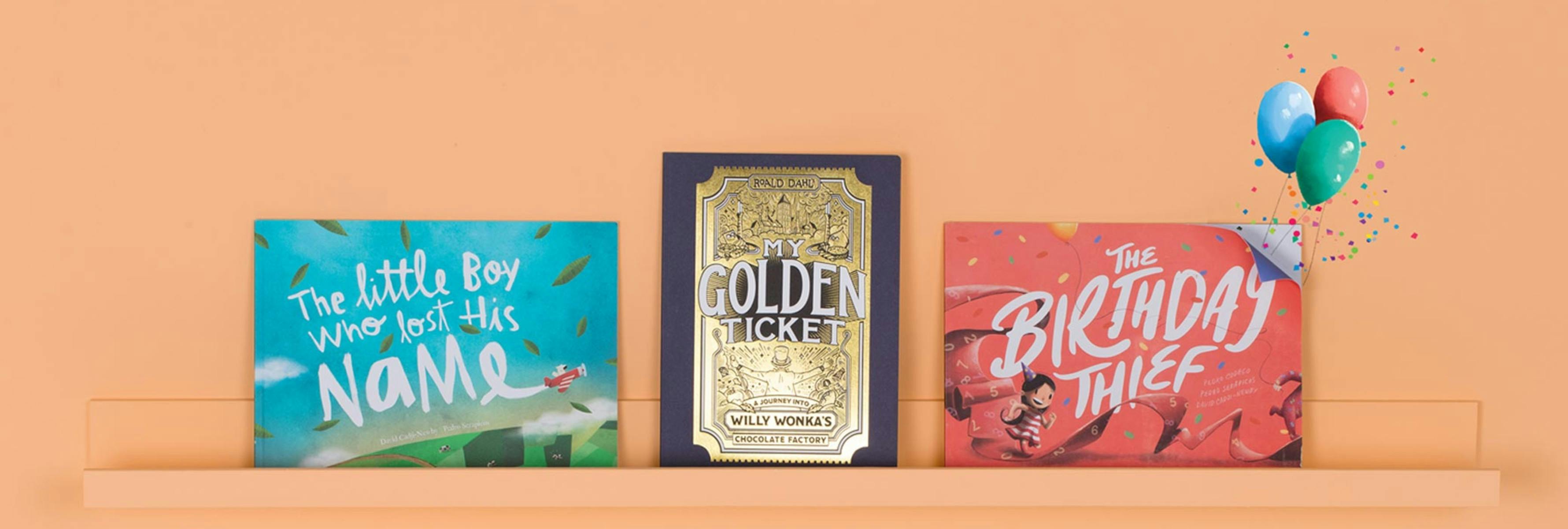 A bookshelf full of our Wonderbly books: Lost My Name, My Golden Ticket, The Birthday Thief