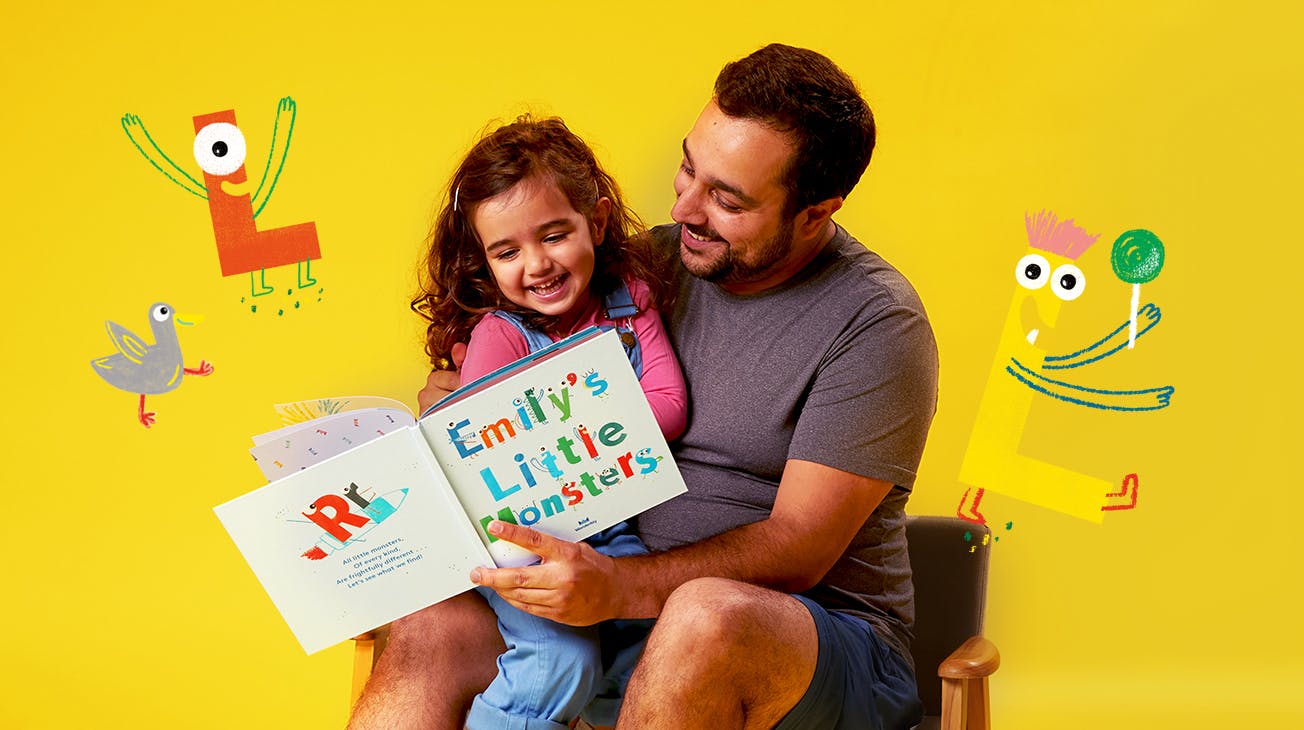 Father and Child reading My Little Monsters