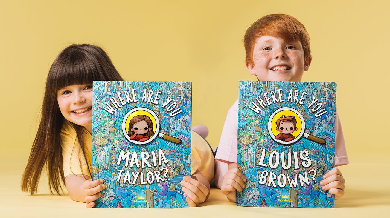 Two children holding their Where are you book